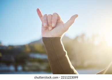 Shaka, Hand Sign And Surfer Outdoor In Nature On An Adventure Or Holiday In Summer In Hawaii. Chill Out Gesture, Friendly And Man With Surf Culture On Tropical Vacation For Fun, Leisure And Freedom.