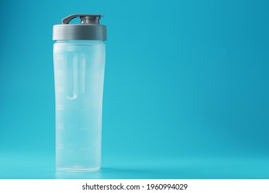 Shaker Is An Empty Plastic Smoothie Cup On A Blue Background. Free Space, Minimalistic Concept