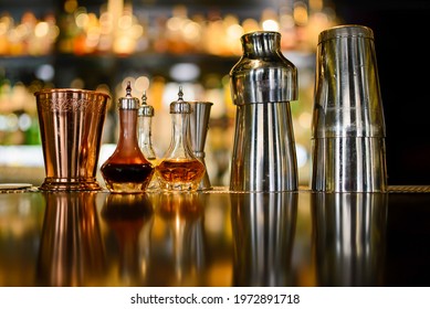 Shakers And Copper Glass And Angostura Bitters On Counter Of The Bar