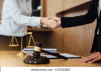 Shaking hands after good cooperation, Business woman handshake female lawyer after discussing good deal of contract, Meeting and collaboration concept.