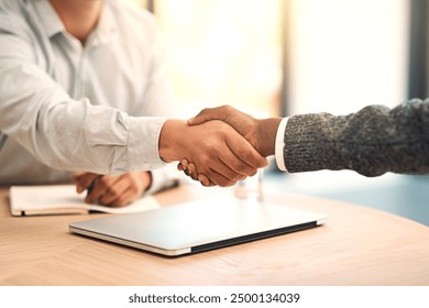 Shaking hands, agreement and partnership in office with business people, thanks and hiring at agency. Manager, onboarding and human resources at job interview with welcome, choice and introduction - Powered by Shutterstock