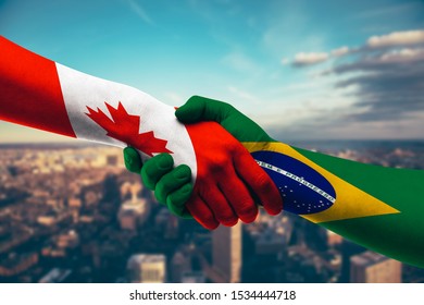 Shaking hands Canada and Brazil