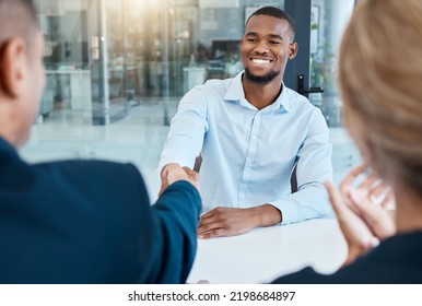 Shaking hands, interview and business people give a handshake after hiring a new company employee. Onboarding, thank you and management welcome young African worker a job promotion in office meeting
