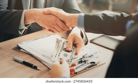 Shaking hands and receiving dollars