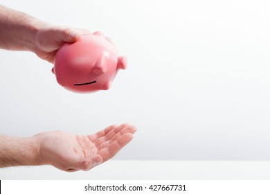 Shaking Out Empty Piggy Bank