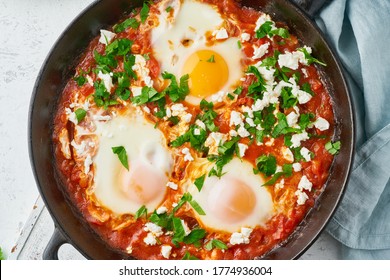 Shakshouka, Eggs Poached In Sauce Of Tomatoes, Olive Oil, Peppers, Onion And Garlic, Mediterranean Cuisine. Keto Meal, FODMAP Recipe, Low Carb