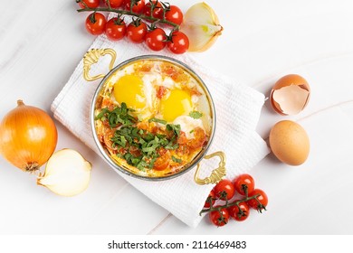 Shakshuka Of Middle Eastern Countries On A White Background With Ingredients