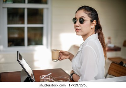 Shallow Depth Of Field Beautiful Portrait Of Young Asian Business Woman Sitting In Coffee Shop Cafe, Attraction Cool Girl Thinking Something, Asia Business People Working From Home Or Outside Office