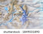 Shallow depth of field focus on geographical map location of Mount Elbert in United States North America continent on atlas