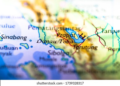 Shallow Depth Of Field Focus On Geographical Map Location Of Lake Toba In Indonesia Asia Continent On Atlas