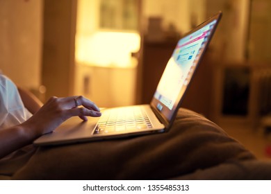 Shallow Depth Of Field Of Lady Doing Research On Laptop At Her Comfortable Home.