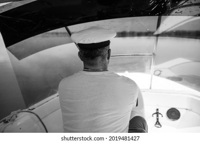 Shallow Depth Of Field (selective Focus) Image With A Small Boat Driver (captain,skipper).