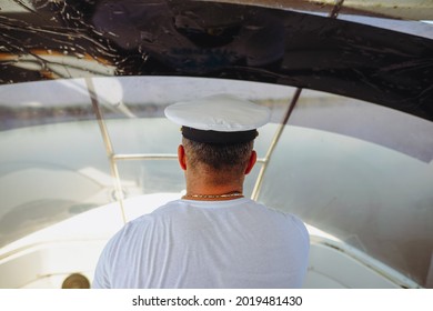 Shallow Depth Of Field (selective Focus) Image With A Small Boat Driver (captain,skipper).