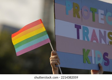 Shallow depth of field (selective focus) with people attending a LGBTQ rights protest.