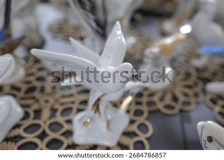 Shallow depth of field (selective focus) details with Romanian communist era ceramic trinkets (bibelouri)