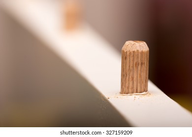 Shallow Depth Of Field And Wooden Dowel In The Wood.