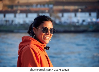 A Shallow Focus Of A Hip Woman Nose Piercing Having A Nice Day Out By The Duero River In Portugal