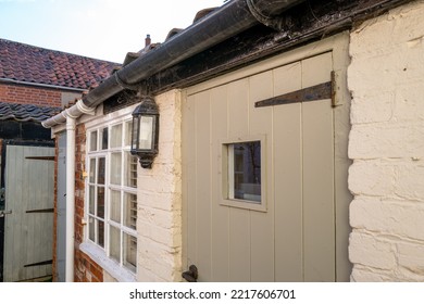 Shallow Focus Of A Narrow Back Door Seen At The Entrance To An Old Holiday Cottage.