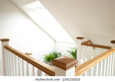 Shallow focus of a wooden post on the 2nd floor of a newly built loft conversion. Showing the large skylight window.