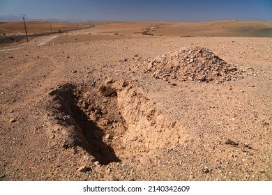 Shallow Grave In The Desert. Agafay Desert Near Marrakesh, Morocco.