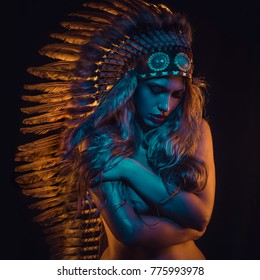 Shaman beautiful girl with plume of american indian feathers