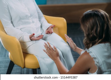 Shamballa Therapist Holding Hands Over Legs of the Female Client