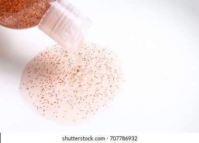 Shampoo containing plastic microbeads poured out from shampoo