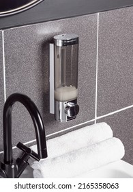 Shampoo Or Soap Dispenser. Wall Dispenser In Bathroom