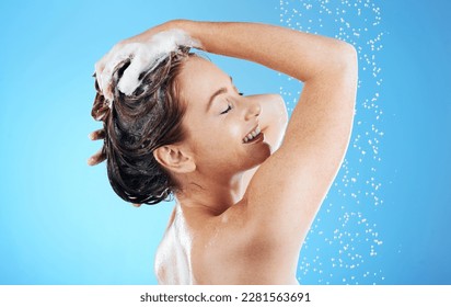 Shampoo, washing hair and smile, woman in shower on blue background for morning bathroom routine in studio mockup. Healthy haircare, water and happiness for happy beauty model cleaning in soapy foam. - Powered by Shutterstock