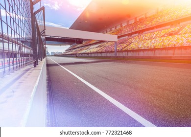 ShangHai, 18 AUG 2017 China: Empty Race Track , Formula 1 Circuit With Patron Grandstand Alongside. Concept Of Spectatorship For Decisive Sport Moments.Empty Board Above An International Racetrack.