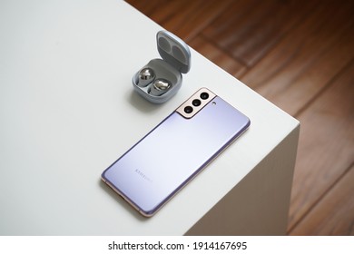 Shanghai, China - 10 February 2021: Samsung Galaxy S21 and Samsung Galaxy Buds Pro in the white color 