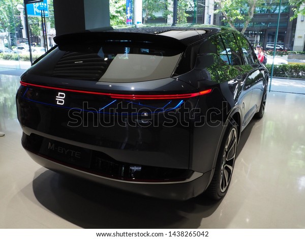 Shanghai/ China - 24th June 2019: Side-rear view\
of the electric, autonomous-drive (level 4) concept car, the black\
Byton M-Byte