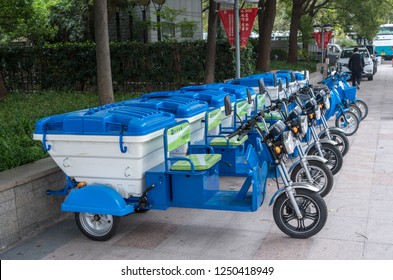 SHANGHAI, CHINA - 25 OCTOBER 2018: Electric Vehicle With Three Wheels For Street Cleaning And Trash Pickup