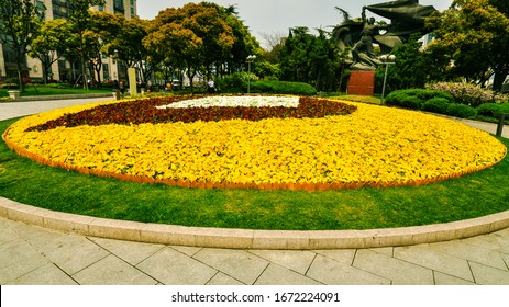 Shanghai, China - Apr. 10, 2012: Large, Round Flower Bed In Public Square.