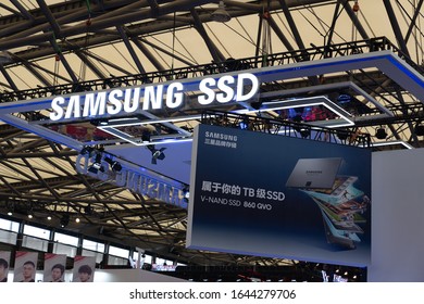 Shanghai, China - Aug 2, 2019: Low angle view of Samsung SSD booth with the billboard of V-NAND SSD 860 QVO hanging on the platform in a game show. 