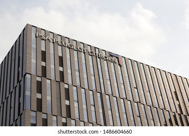 Shanghai, China - Aug 20, 2019: The PSA Peugeot Citroën Sign At Groupe PSA Shanghai Office In Caohejing Hi-Tech Park.