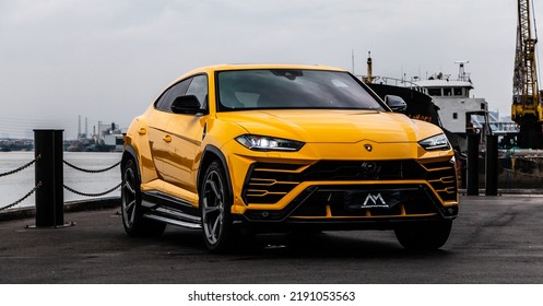 Shanghai, China- August 8,2022: A Yellow Lamborghini Urus Suv Is Parked By Huangpu River