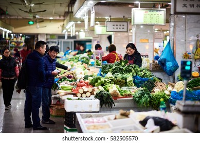 Shanghai, China - February 18, 2017: Typical Chinese Wet Market. Vegetable Stalls.  