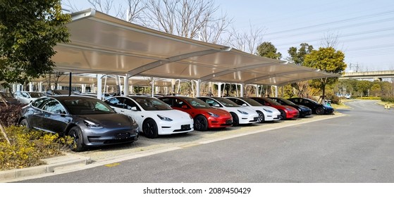 Shanghai, China - February 20 2021: The Parking Lot Outside Of Shanghai Tesla Factory Shop In Pudong New District, China. 