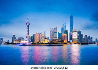 Shanghai, China Financial District Skyline On The Huangpu River.