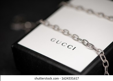 Shanghai, China - January 21, 2020: Gucci Gift Packaging With Silver Necklace. 