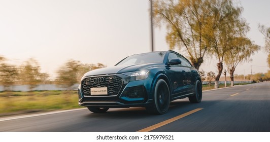 Shanghai, China- July 2,2022: A Blue Audi RS Q8 SUV Is Driven On Road