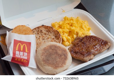 SHANGHAI, CHINA - JULY 8, 2017 : Scrambled Egg, Hash Brown, Bread And Roasted Chicken One Of The Meals Choice At McDonald's Breakfast Specials.