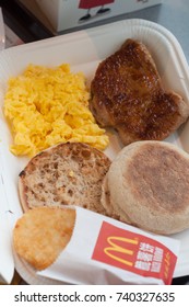 SHANGHAI, CHINA - JULY 8, 2017 : Scrambled Egg, Hash Brown, Bread And Roasted Chicken One Of The Meals Choice At McDonald's Breakfast Specials.