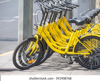 Shanghai, China - March 3, 2017:  Rows Of Bicycles Are Placed On The Side Of The Road In Shanghai. Ofo Bikes Is A Bike Sharing Company In China.