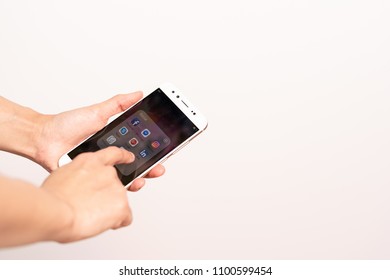 SHANGHAI, CHINA - MAY, 2018 : Women hand touching smartphone screen with icons of social media, smartphone life style - Shutterstock ID 1100599454