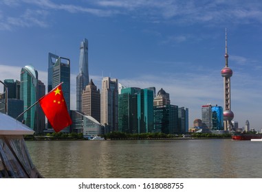 Shanghai, China - May 23, 2018: Chinese Flag And Modern Pudong Skyline In Shanghai, China.