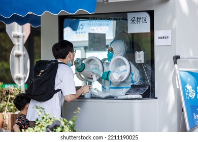 SHANGHAI, CHINA - May 31, 2018: A Male Testing For Covid Near Mobile Testing Facilities For Rapid Antigen Tests In Shanghai