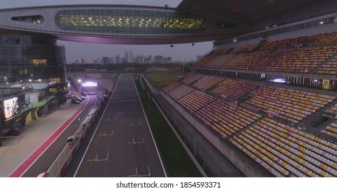 Shanghai, China - November, 16 2018: Empty Race Track , Formula 1 Circuit With Patron Grandstand Alongside. Concept Of Spectatorship For Decisive Sport Moments. Empty Board Above An International