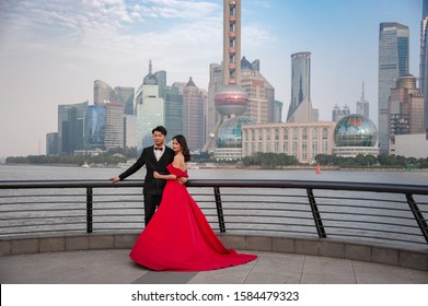 Shanghai, China - November 2019: Young Couple Posing For Pre-wedding Photos On The Bund.Pre-wedding Photo Shoots Are A Tradition, And Billion Dollar Industry In China Today.